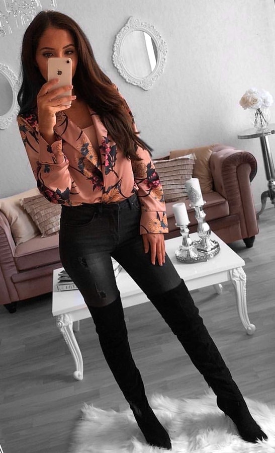 Women's brown long-sleeved shirt, black denim skinny jeans, and pair of black booties outfit.