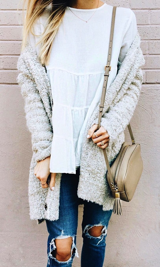 Women's crew-neck white top with grey cardigan.