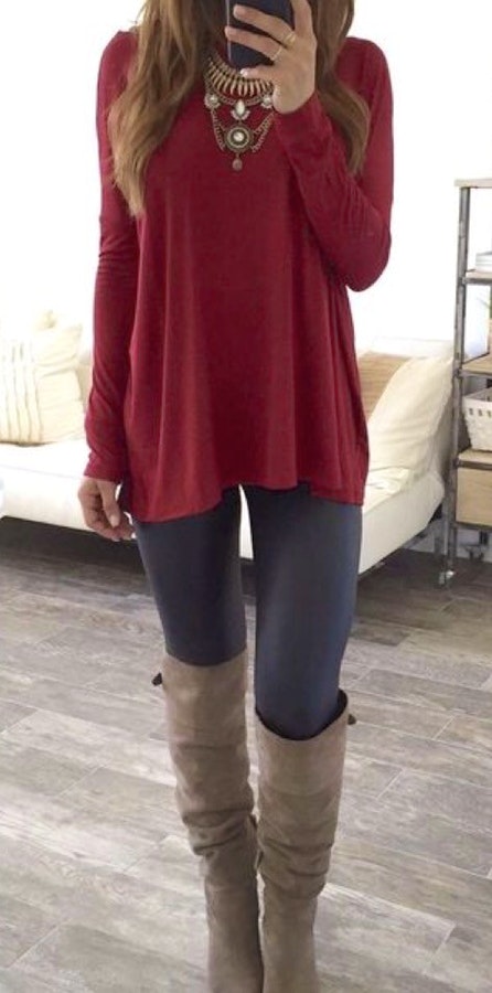 Women's red long-sleeved blouse and fitted pants.