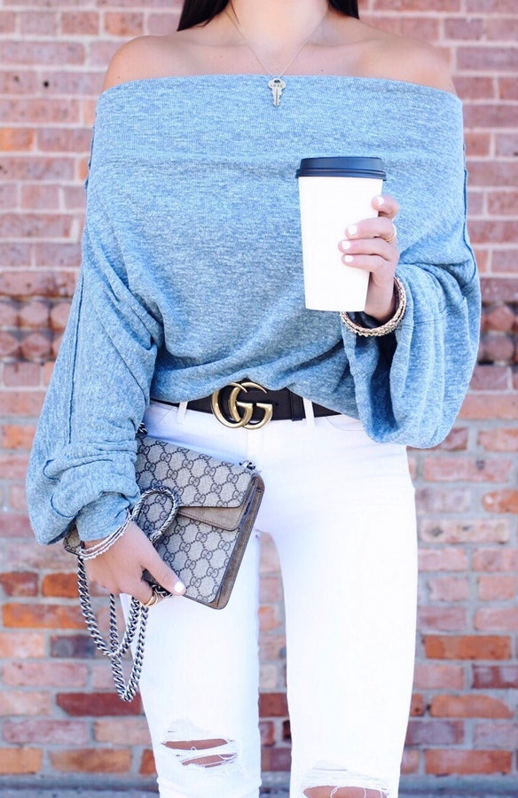 women's gray off-shoulder top and white denim jeans outfit.